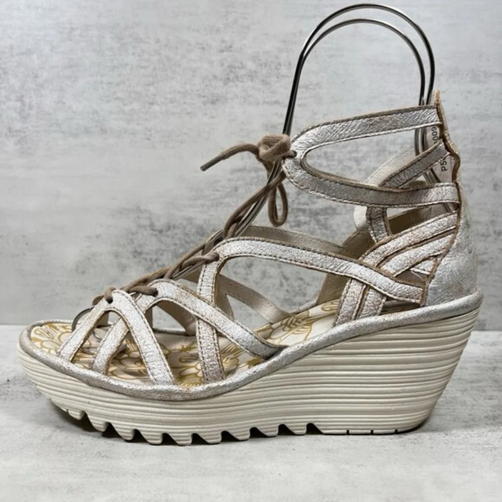 Fly London Yuke wedge sandals in a‎ metallic pearl or rose gold color 36/5.5-6